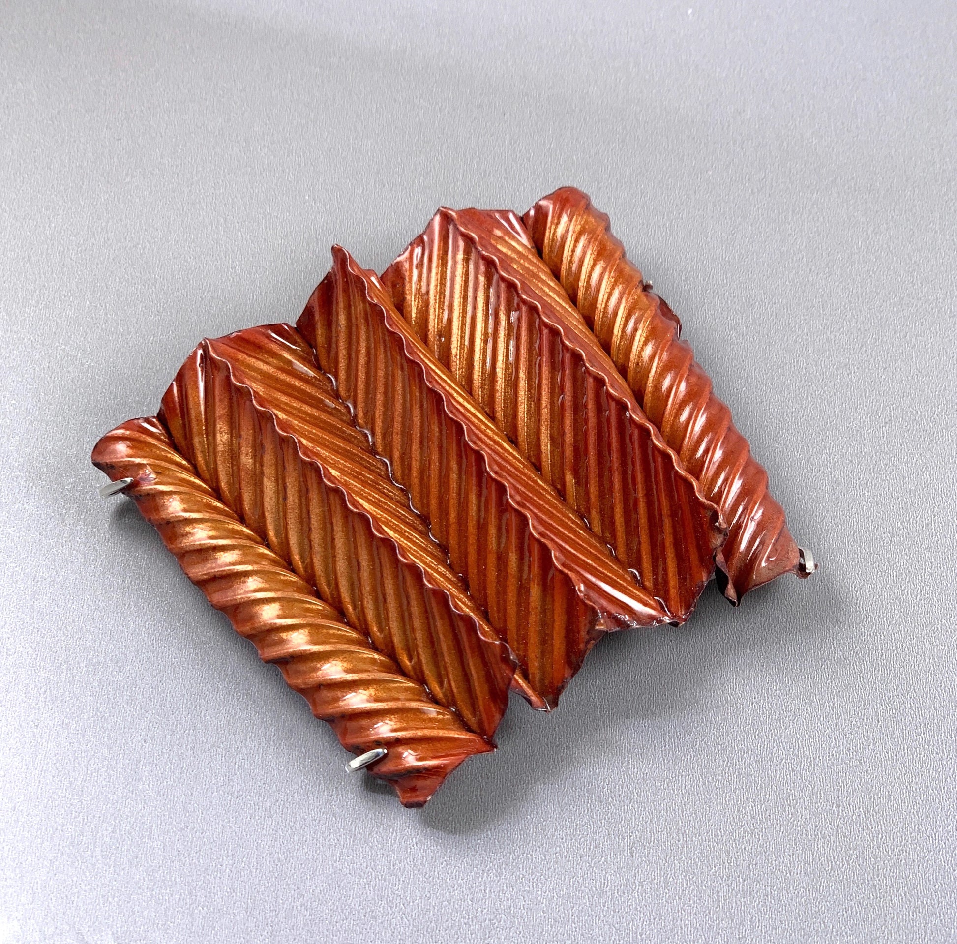 large corrugated 3 D enameled copper brooch
