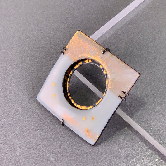 opalescent white kiln fired enamel over 24K gold and set into oxidized sterling silver