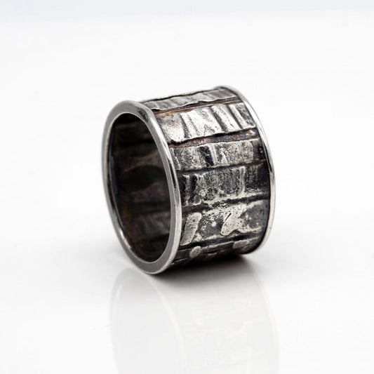 fused textural patterns sterling silver band style ring with patina