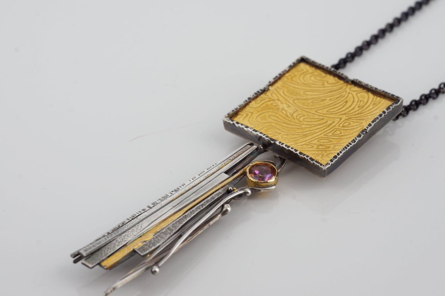 silver and 24k gold pendant