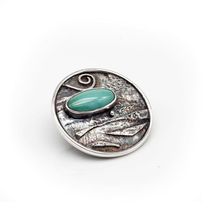 organic textured silver pin with turquoise