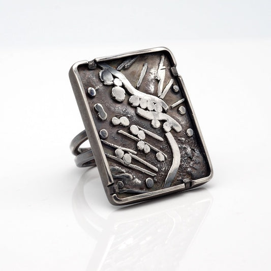 modernist statement ring of highly textured oxidized sterling silver