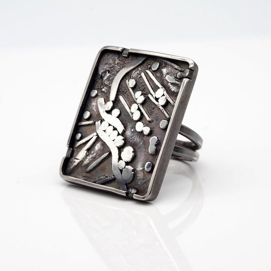 big statement ring with highly textured sterling silver design